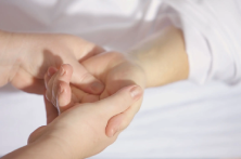 hand massages woman